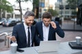 amazed businessmen trading online outdoor. businessmen trading online with laptop. Royalty Free Stock Photo