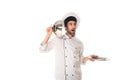 Amazed chef holding cloche near ear