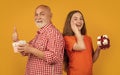 amazed child and granddad with present box for anniversary. thumb up Royalty Free Stock Photo