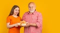 amazed child and grandfather with present box for anniversary Royalty Free Stock Photo