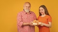 amazed child and grandfather with present box for anniversary Royalty Free Stock Photo