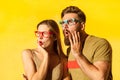 Amazed couple in glasses looking away with astonished facial expression, being shocked and surprised Royalty Free Stock Photo