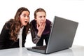 Amazed couple on line with a laptop Royalty Free Stock Photo