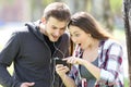 Amazed couple listening music on line