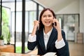 Amazed female worker talking on the smartphone hearing unexpected good news Royalty Free Stock Photo