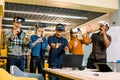 Amazed five young people freelancers coworkers touching the air during the VR experience. Horizontal shot.