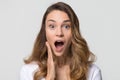 Amazed funny young woman with surprised face looking at camera Royalty Free Stock Photo