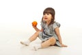 Amazed girl holding mandarin Royalty Free Stock Photo