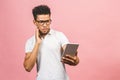 Amazed happy afro american guy holding using digital tablet looking shocked about social media news, astonished man shopper Royalty Free Stock Photo