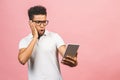 Amazed happy guy holding using digital tablet looking shocked about social media news, astonished man shopper consumer surprised Royalty Free Stock Photo