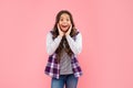 amazed kid with curly hair. teen hipster beauty hairstyle. female casual fashion model. Royalty Free Stock Photo