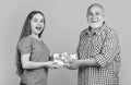 amazed kid and granddad with present box for anniversary Royalty Free Stock Photo