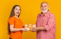 amazed kid and granddad with present box for anniversary Royalty Free Stock Photo