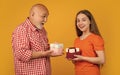 amazed kid and grandfather with present box for anniversary Royalty Free Stock Photo
