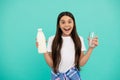 amazed kid hold glass and milk bottle. child hold dairy beverage product.