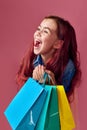 little caucasian child girl holds shopping bags Royalty Free Stock Photo