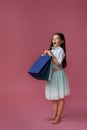 happy little child girl holds many shopping bags Royalty Free Stock Photo