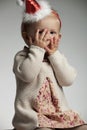Amazed little girl with palms oll over face Royalty Free Stock Photo