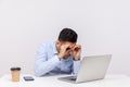 Amazed male office employee looking at laptop screen through binoculars hand gesture expressing big surprise Royalty Free Stock Photo