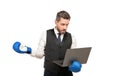 amazed man in boxing gloves and suit hold laptop isolated on white background, cyber bullying Royalty Free Stock Photo