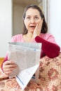 Amazed mature woman with newspaper Royalty Free Stock Photo