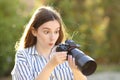 Amazed photographer checking result on camera