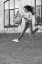 amazed school girl jump childhood at the street. photo of school girl jump childhood