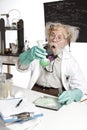 Amazed senior scientist with foaming beaker Royalty Free Stock Photo