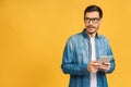 Amazed shocked happy bearded man using digital tablet looking shocked about social media news, astonished man shopper consumer Royalty Free Stock Photo