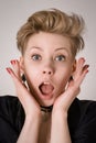 Amazed, shocked or surprised blond woman