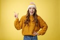 Amazed surprised carefree happy young joyful woman laughing surprised widen eyes wondered see funny prank pointing upper Royalty Free Stock Photo