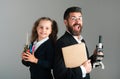 Amazed teacher with excited happy pupil school girl. Portrait of funny school girl and tutor with school supplies. Happy Royalty Free Stock Photo