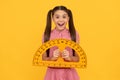 amazed teen girl hold protractor ruler. back to school. algebra and geometry.