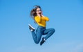 amazed teen girl jump high on sky background Royalty Free Stock Photo