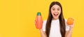 amazed teen girl long hair with body lotion and grapefruit on yellow background, cosmetic. Banner of child girl hair