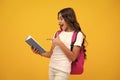 Amazed teen girl. School girl teenager child with book and copybook. Teenager schoolgirl student with backpack, isolated Royalty Free Stock Photo
