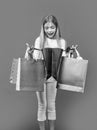 amazed teen girl with shopping purchase in studio. teen girl with shopping purchase Royalty Free Stock Photo