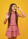 Amazed teen girl. Teenager child with poor eyesight wear eyeglasses, looking squinting. Kids glasses. Funny surprised Royalty Free Stock Photo