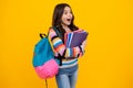 Amazed teenager. Back to school. Teenager schoolgirl hold book and copybook ready to learn. School children on isolated Royalty Free Stock Photo