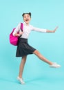 Amazed teenager. School teen girl in with backpack. Teenager student on blue isolated background. Jump and run. Learning