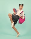 Amazed teenager. School teenage girl with book and copybook. Teenager schoolgirl student, isolated background. Learning Royalty Free Stock Photo