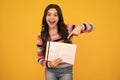 Amazed teenager. Teenage school girl with books. Schoolgirl student. Excited teen girl.