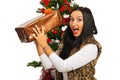 Amazed woman with Christmas present Royalty Free Stock Photo