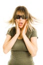 Amazed woman in cinema wearing 3D glasses experiencing 5D cinema effect- scared watching movie - gestures of astonishment