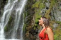 Amazed woman contemplating waterfall Royalty Free Stock Photo