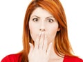 Amazed woman with hand over mouth Royalty Free Stock Photo