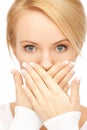 Amazed woman with hand over mouth Royalty Free Stock Photo