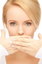 Amazed woman with hand over mouth Royalty Free Stock Photo