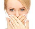 Amazed woman with hand over mouth Royalty Free Stock Photo