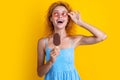 amazed woman with icecream isolated on yellow. woman with icecream in studio